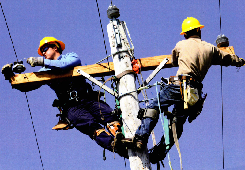 Two lineman on a pole